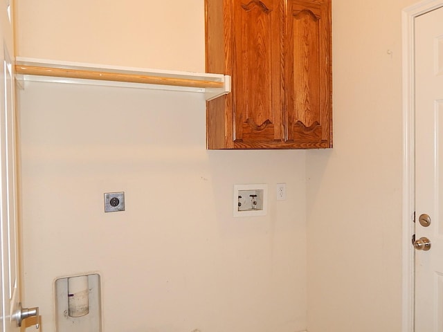 washroom featuring washer hookup, electric dryer hookup, and cabinet space