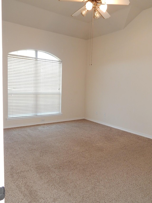 unfurnished room featuring carpet floors, a ceiling fan, and baseboards