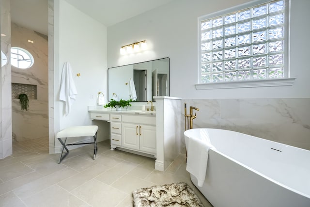 12809 Day Break Trl, Burleson, TX 76028 - full bath featuring vanity, a freestanding bath, tile walls, a marble finish shower, and wainscoting