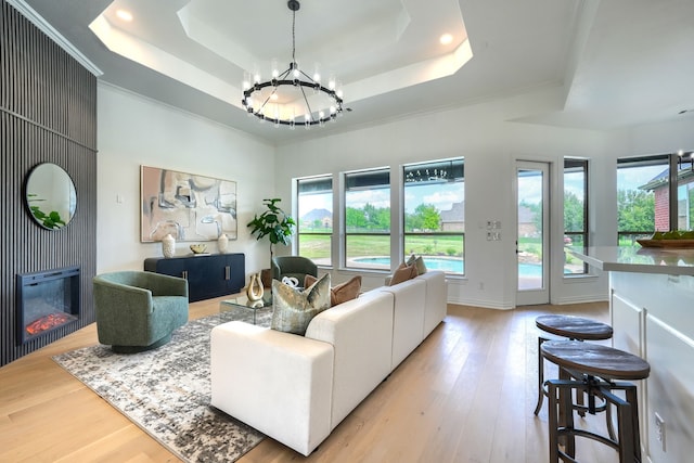 12809 Day Break Trl, Burleson, TX 76028 - living area featuring a raised ceiling, a chandelier, healthy amount of natural light, recessed lighting, and ornamental molding