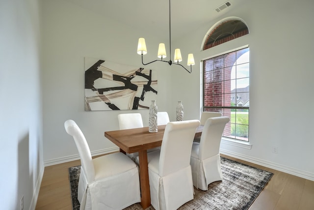 12809 Day Break Trl, Burleson, TX 76028 - dining space featuring a chandelier, baseboards, and wood finished floors