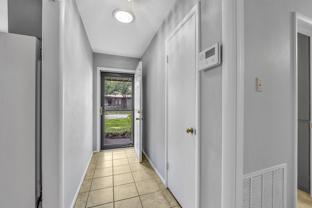 6324 Woodbine Dr, Fort Worth, TX 76112 - doorway featuring light tile patterned flooring and baseboards