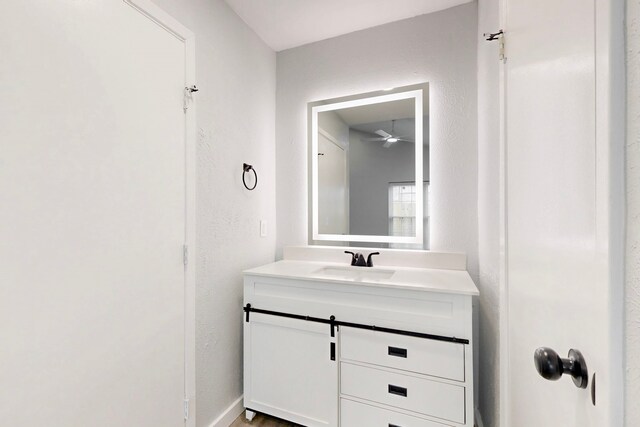 bathroom featuring vanity and ceiling fan