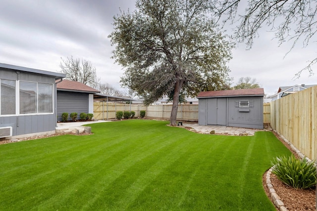 view of yard with a storage shed and an outdoor structure