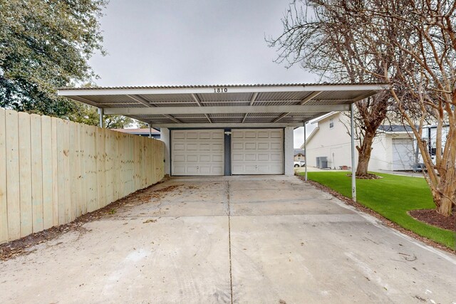 garage with concrete driveway