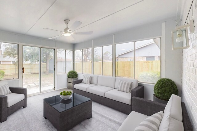 sunroom / solarium with a ceiling fan and outdoor lounge area
