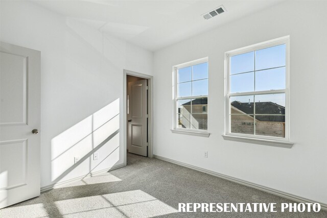 5236 Springlake Pkwy, Haltom City, TX 76117 - spare room with carpet floors