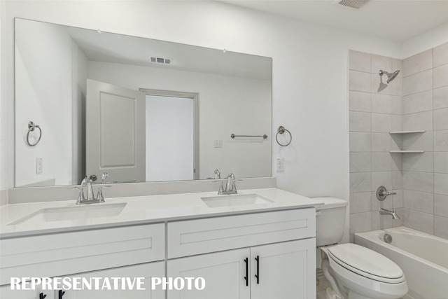 5236 Springlake Pkwy, Haltom City, TX 76117 - full bath with toilet, double vanity, and bathing tub / shower combination