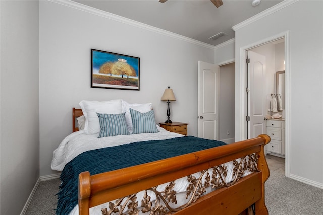 bedroom featuring carpet floors, baseboards, crown molding, ensuite bath, and ceiling fan