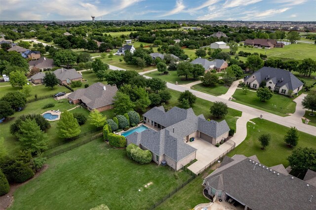 aerial perspective of suburban area with a pool