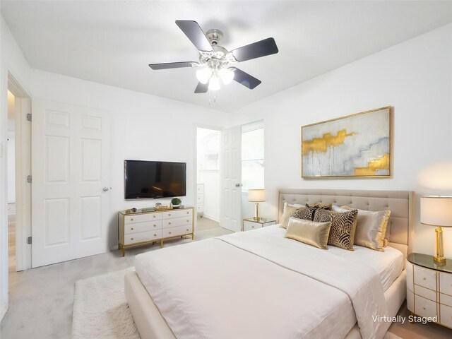 carpeted bedroom with a ceiling fan