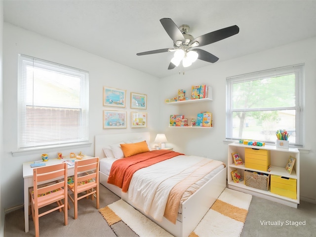 carpeted bedroom with ceiling fan
