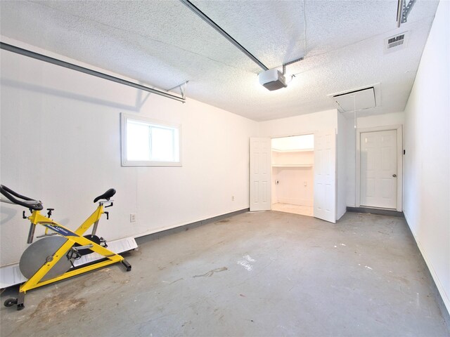 garage with a garage door opener and baseboards