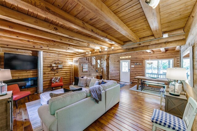 7386 Clint Ct, Athens, TX 75752 - living area featuring stairway, hardwood / wood-style floors, beam ceiling, and wood ceiling