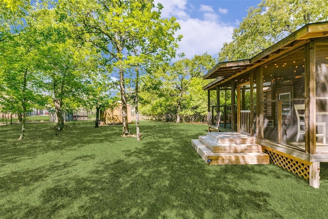 7386 Clint Ct, Athens, TX 75752 - view of green lawn with a sunroom