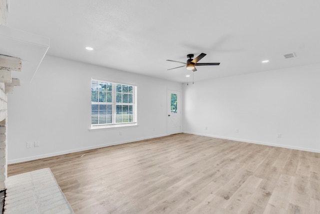 unfurnished living room featuring ceiling fan, recessed lighting, light wood-style flooring, baseboards, and a fireplace