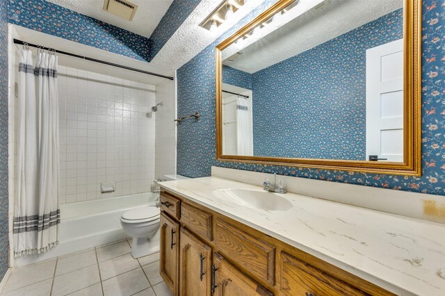 full bathroom featuring tile patterned floors, vanity, a textured ceiling, shower / bathtub combination with curtain, and toilet