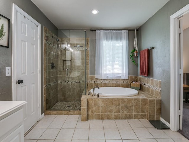 full bathroom with a stall shower, a garden tub, tile patterned flooring, and recessed lighting