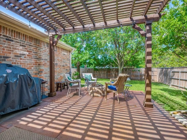 view of patio / terrace featuring an outdoor fire pit, a pergola, and area for grilling
