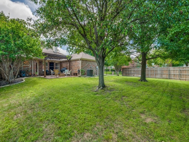 view of yard featuring a patio area and central AC