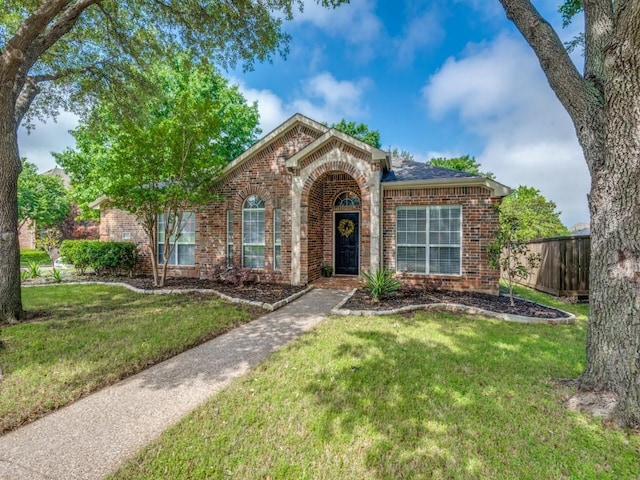 traditional-style home featuring brick siding