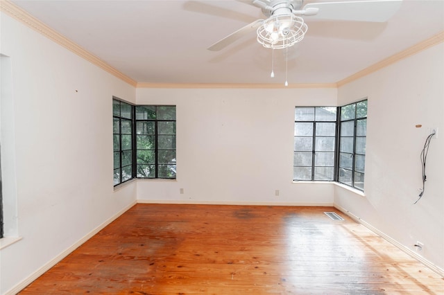 2850 Claudette Ave, Dallas, TX 75211 - spare room with plenty of natural light, a ceiling fan, wood finished floors, and crown molding