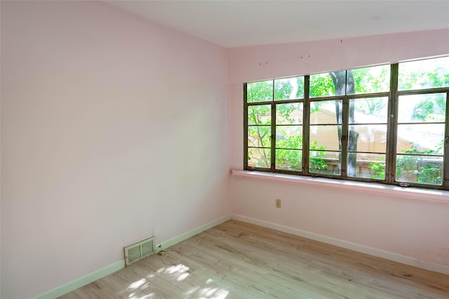2850 Claudette Ave, Dallas, TX 75211 - unfurnished room featuring wood finished floors and baseboards