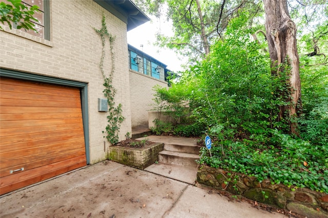 2850 Claudette Ave, Dallas, TX 75211 - view of side of home with brick siding and a garage
