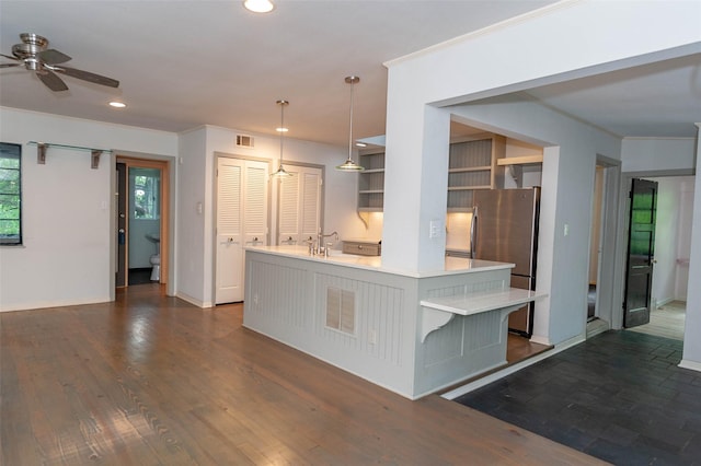2850 Claudette Ave, Dallas, TX 75211 - kitchen with freestanding refrigerator, light countertops, dark wood-type flooring, a ceiling fan, and recessed lighting