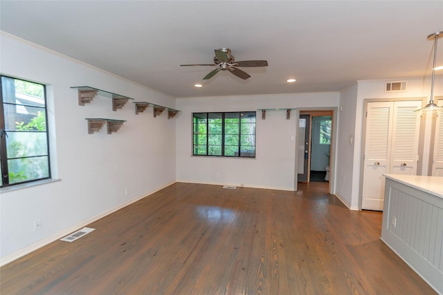 2850 Claudette Ave, Dallas, TX 75211 - unfurnished living room with a ceiling fan, plenty of natural light, dark wood-style floors, recessed lighting, and baseboards