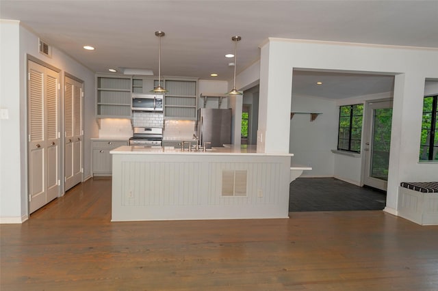 2850 Claudette Ave, Dallas, TX 75211 - kitchen featuring appliances with stainless steel finishes, light countertops, open shelves, dark wood-style floors, and recessed lighting