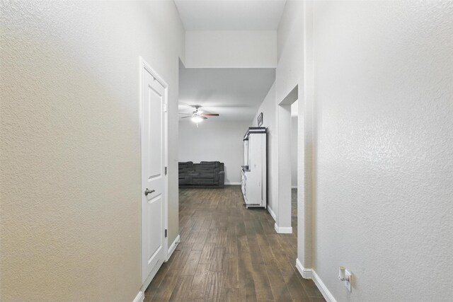 1206 Burlingame Dr, Cleburne, TX 76033 - hall featuring dark wood-style flooring, baseboards, and a textured wall