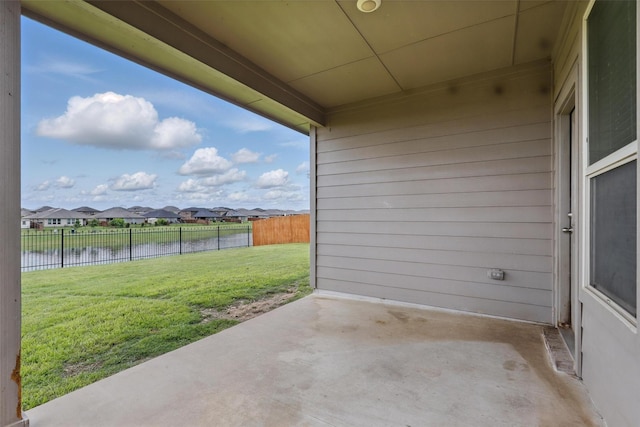 1206 Burlingame Dr, Cleburne, TX 76033 - view of patio with a water view and a residential view