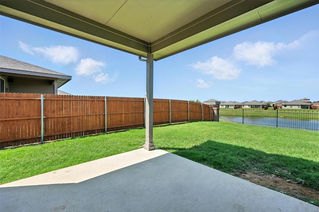 1206 Burlingame Dr, Cleburne, TX 76033 - fenced backyard featuring a water view, a patio area, and a residential view