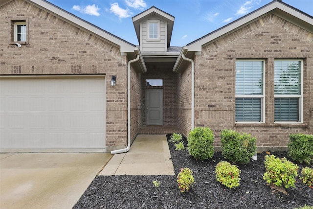 1206 Burlingame Dr, Cleburne, TX 76033 - view of front of property with brick siding, concrete driveway, and an attached garage