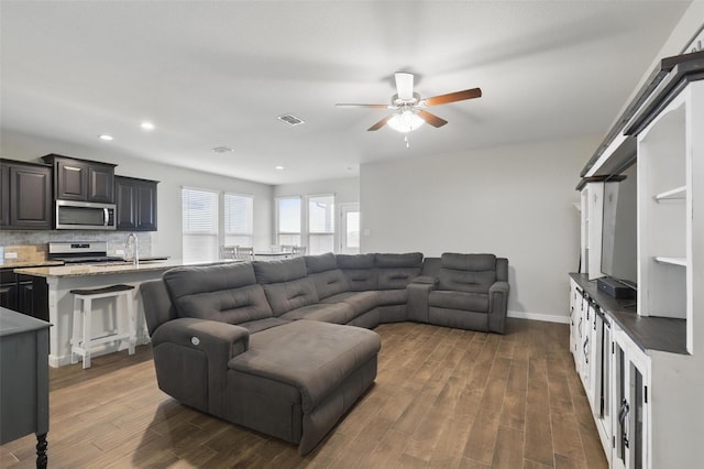 1206 Burlingame Dr, Cleburne, TX 76033 - living room featuring a ceiling fan, dark wood finished floors, recessed lighting, and baseboards