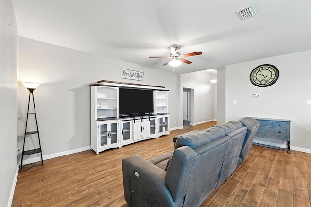 1206 Burlingame Dr, Cleburne, TX 76033 - living area with wood finished floors and a ceiling fan