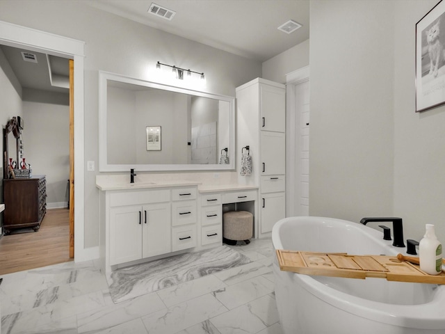 650 Winkler Way, Springtown, TX 76082 - full bath featuring vanity, marble finish floors, a freestanding bath, and baseboards