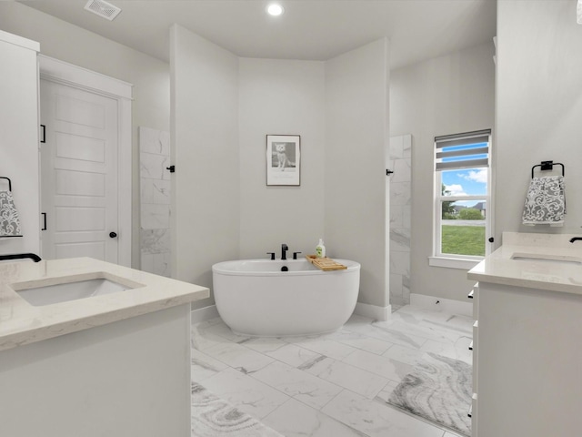 650 Winkler Way, Springtown, TX 76082 - full bathroom featuring a marble finish shower, marble finish flooring, two vanities, a freestanding tub, and recessed lighting
