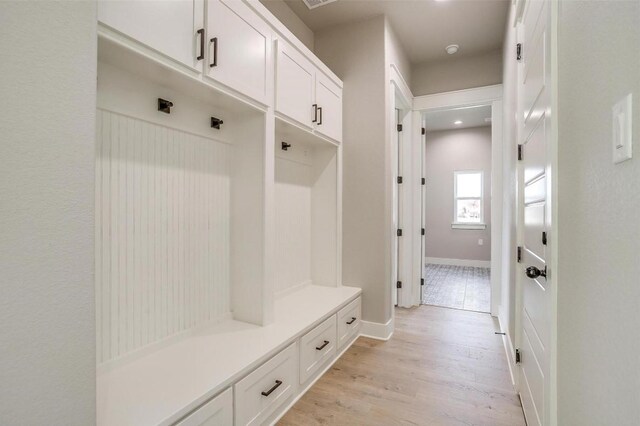 650 Winkler Way, Springtown, TX 76082 - mudroom with light wood-type flooring and baseboards