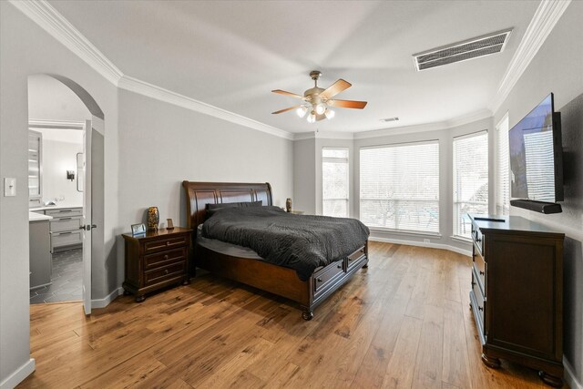 5610 Kensington Ct, Parker, TX 75002 - bedroom featuring arched walkways, light wood-style flooring, crown molding, baseboards, and a ceiling fan