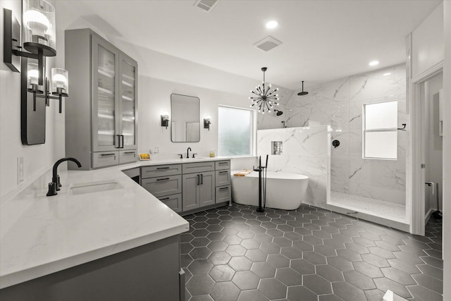5610 Kensington Ct, Parker, TX 75002 - full bathroom with plenty of natural light, recessed lighting, a marble finish shower, a chandelier, and a soaking tub