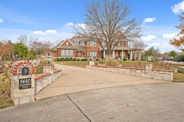 5610 Kensington Ct, Parker, TX 75002 - view of front facade featuring brick siding and a porch