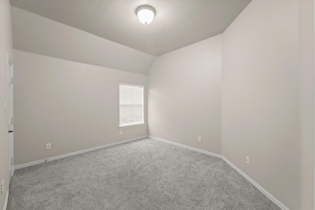 5610 Kensington Ct, Parker, TX 75002 - carpeted empty room featuring vaulted ceiling and baseboards