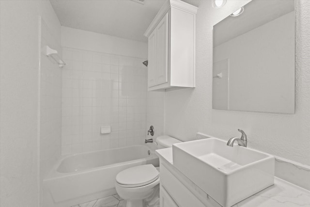5610 Kensington Ct, Parker, TX 75002 - bathroom featuring marble finish flooring, toilet, a textured wall, washtub / shower combination, and vanity