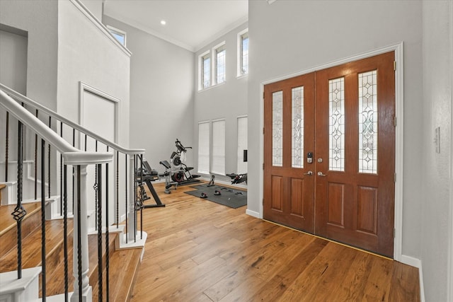 5610 Kensington Ct, Parker, TX 75002 - entrance foyer featuring stairs, ornamental molding, wood-type flooring, a towering ceiling, and baseboards