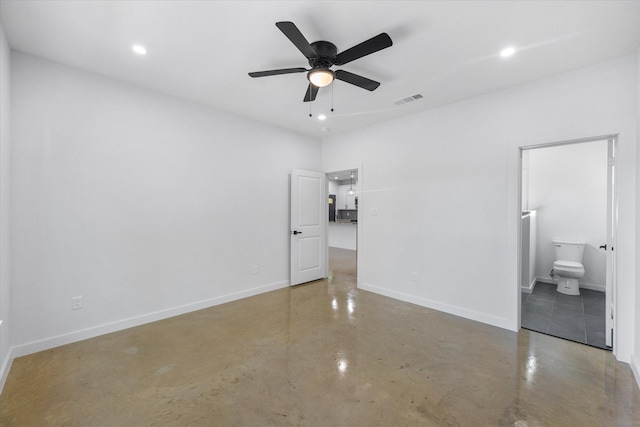 unfurnished bedroom with concrete flooring, baseboards, recessed lighting, ensuite bath, and ceiling fan