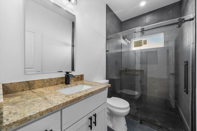 full bathroom featuring toilet, vanity, a shower stall, and tile patterned flooring