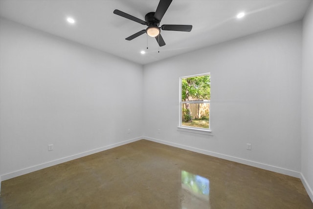 empty room featuring recessed lighting, baseboards, finished concrete flooring, and ceiling fan