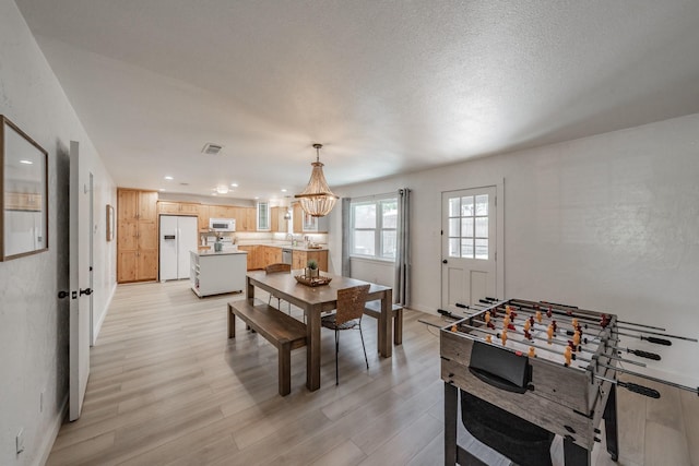 3048 Golfing Green Dr, Farmers Branch, TX 75234 - playroom with light wood-style flooring, a chandelier, and recessed lighting